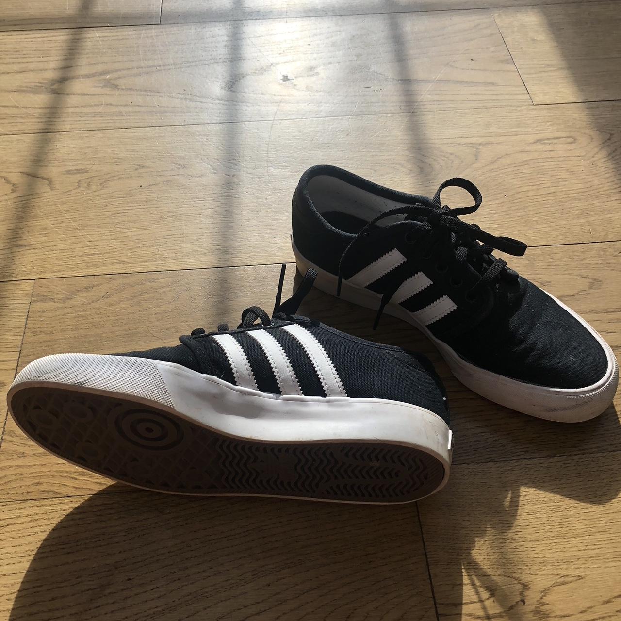 womans black adidas trainers