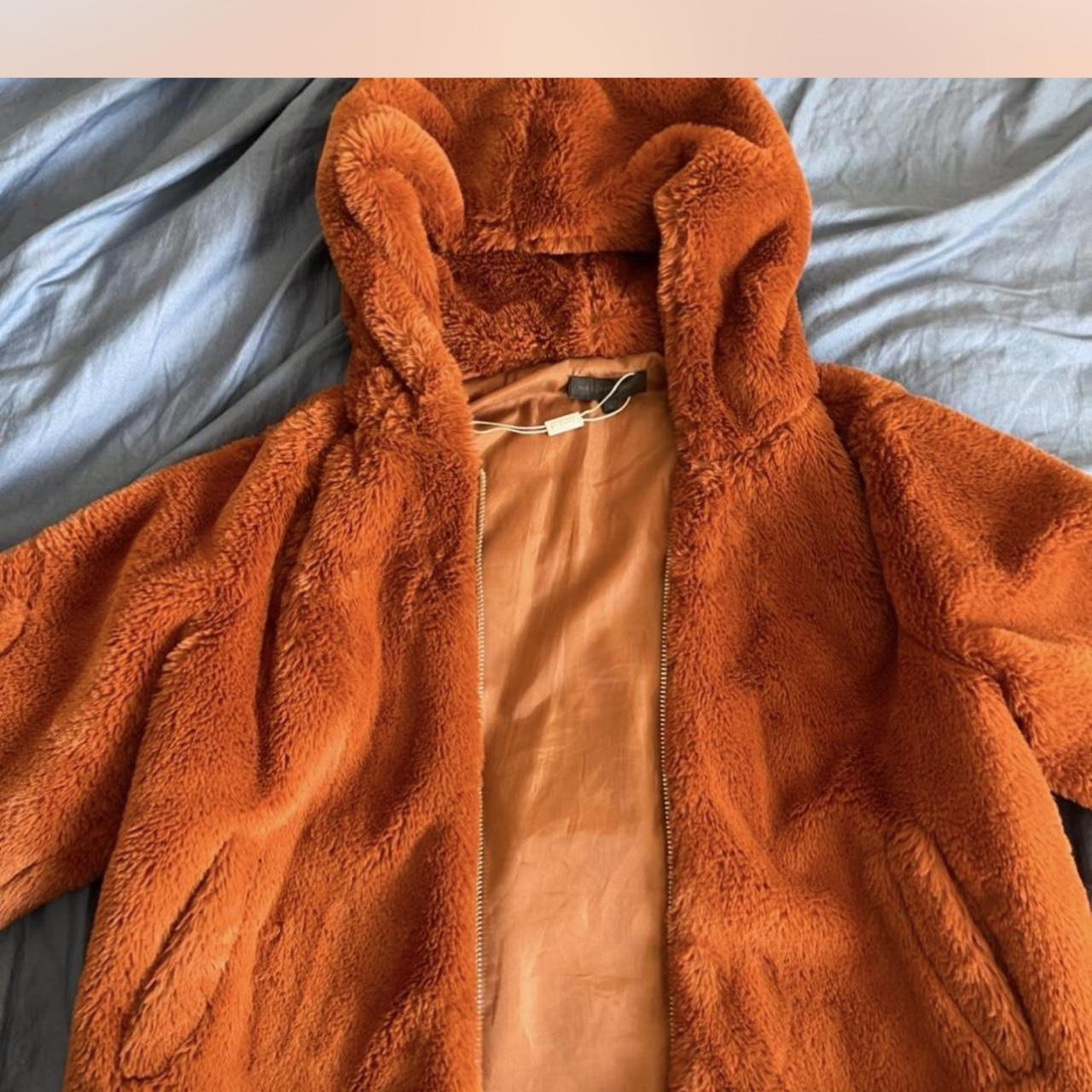 Super soft and warm orange teddy bear zip up. Depop