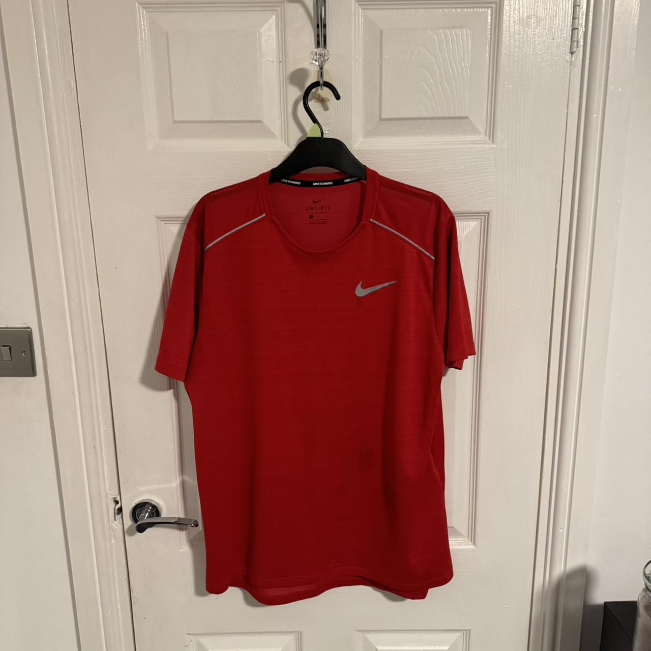Nike red Dri-Fit t shirt. Large size. Small stain on... - Depop