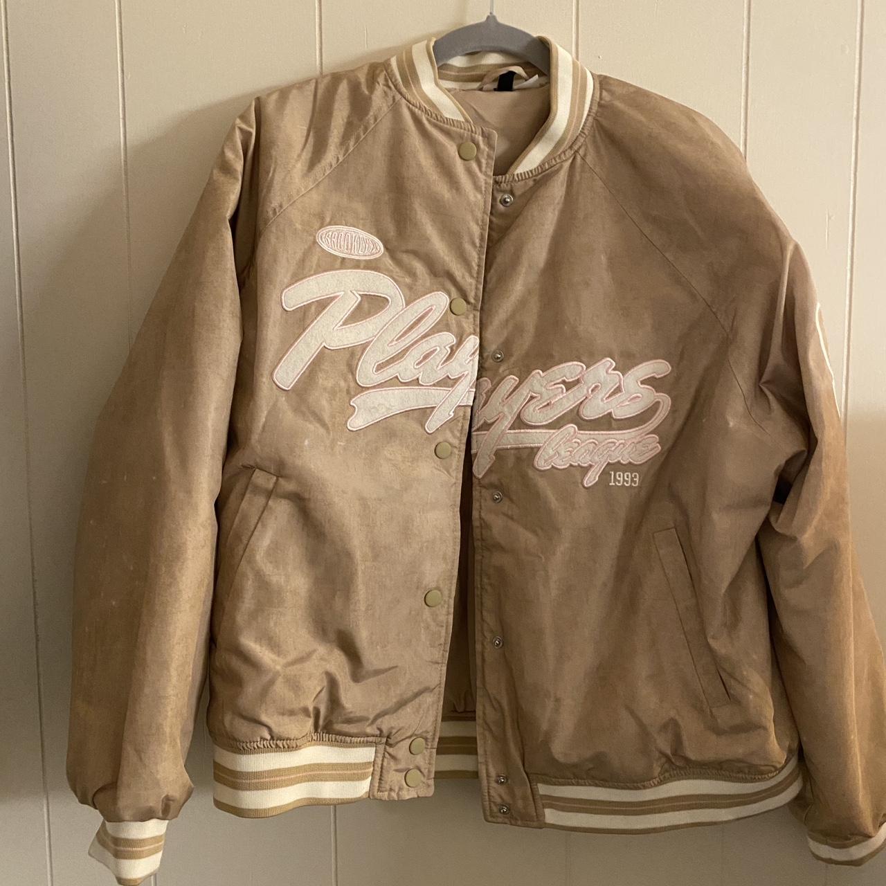 Gold varsity jacket with embroidered pink details.... - Depop