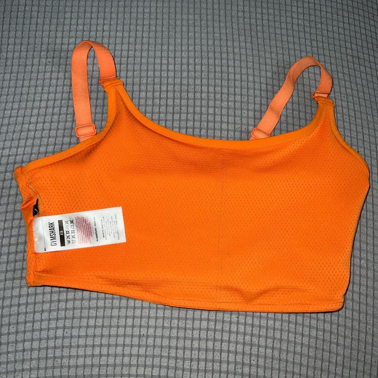 small orange gymshark sports bra worn once, - Depop