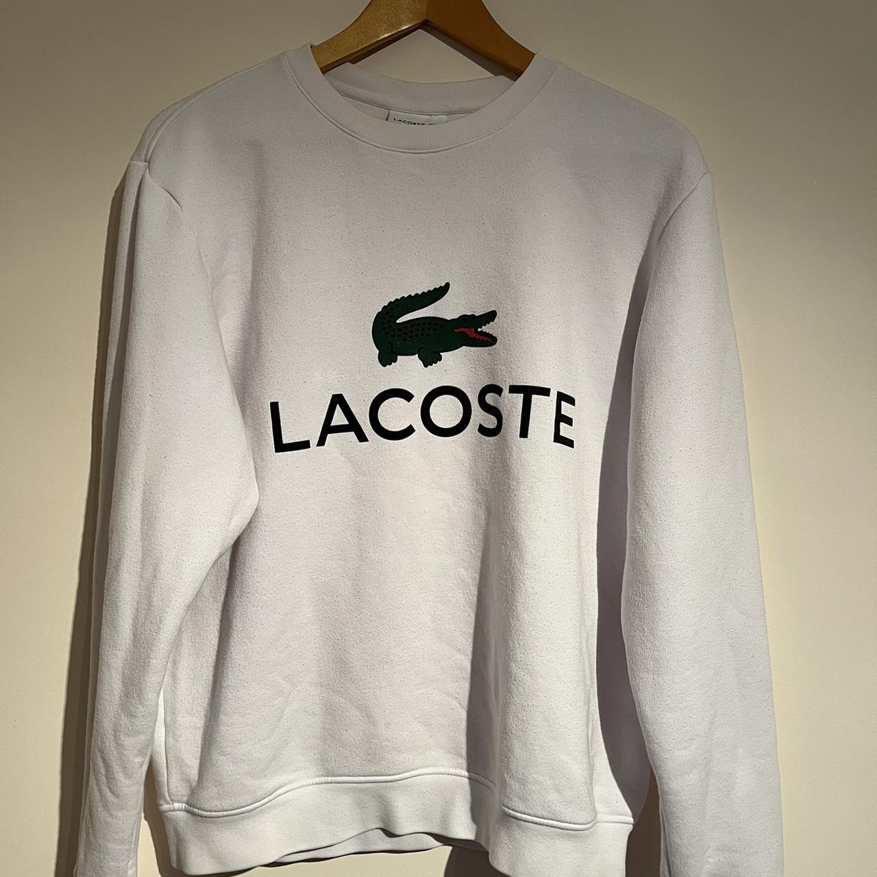 Lacoste jumper in white with print logo across the... - Depop