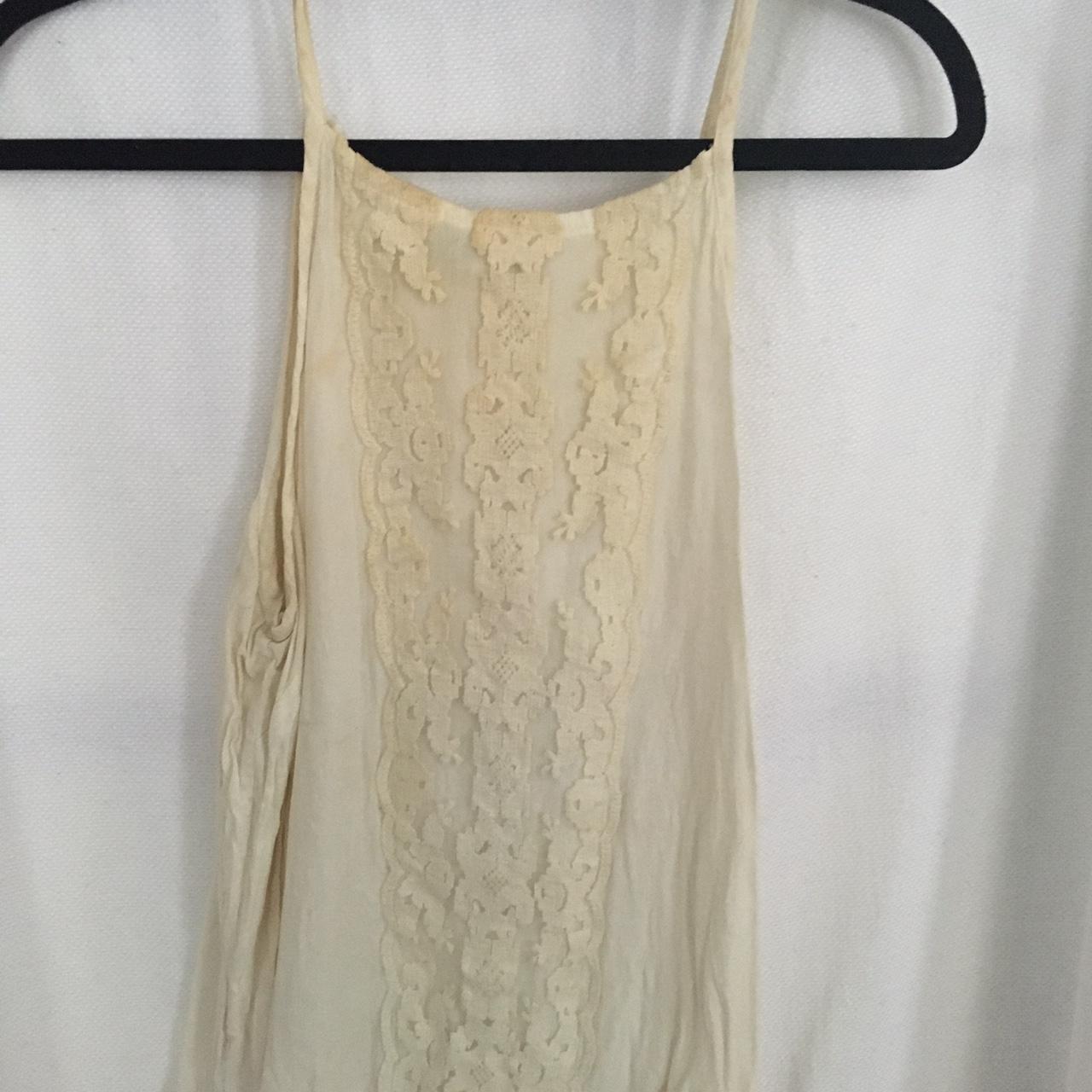 White ivory dress tank in size small. Mild color... - Depop