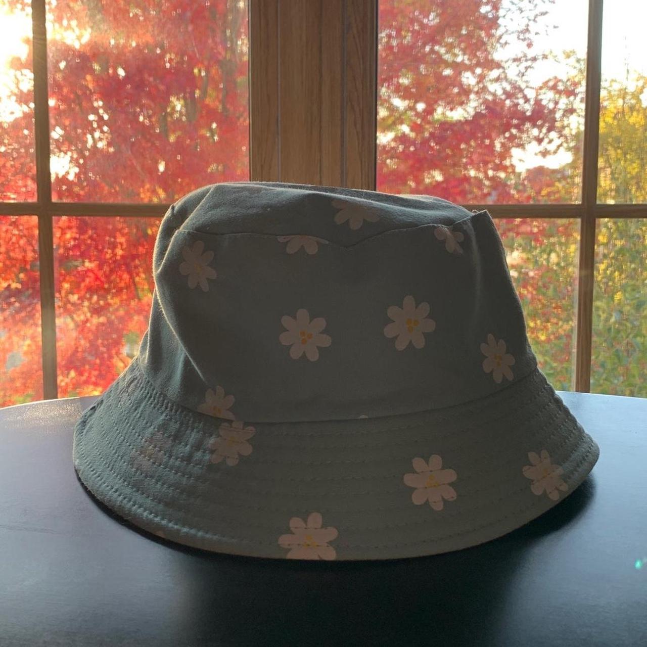 Super cute light blue bucket hat with white flowers.... Depop