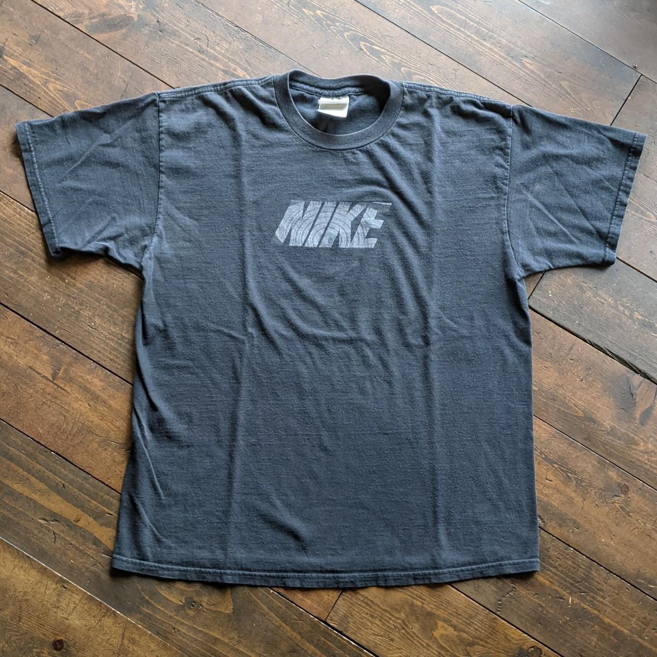 black and silver nike shirt