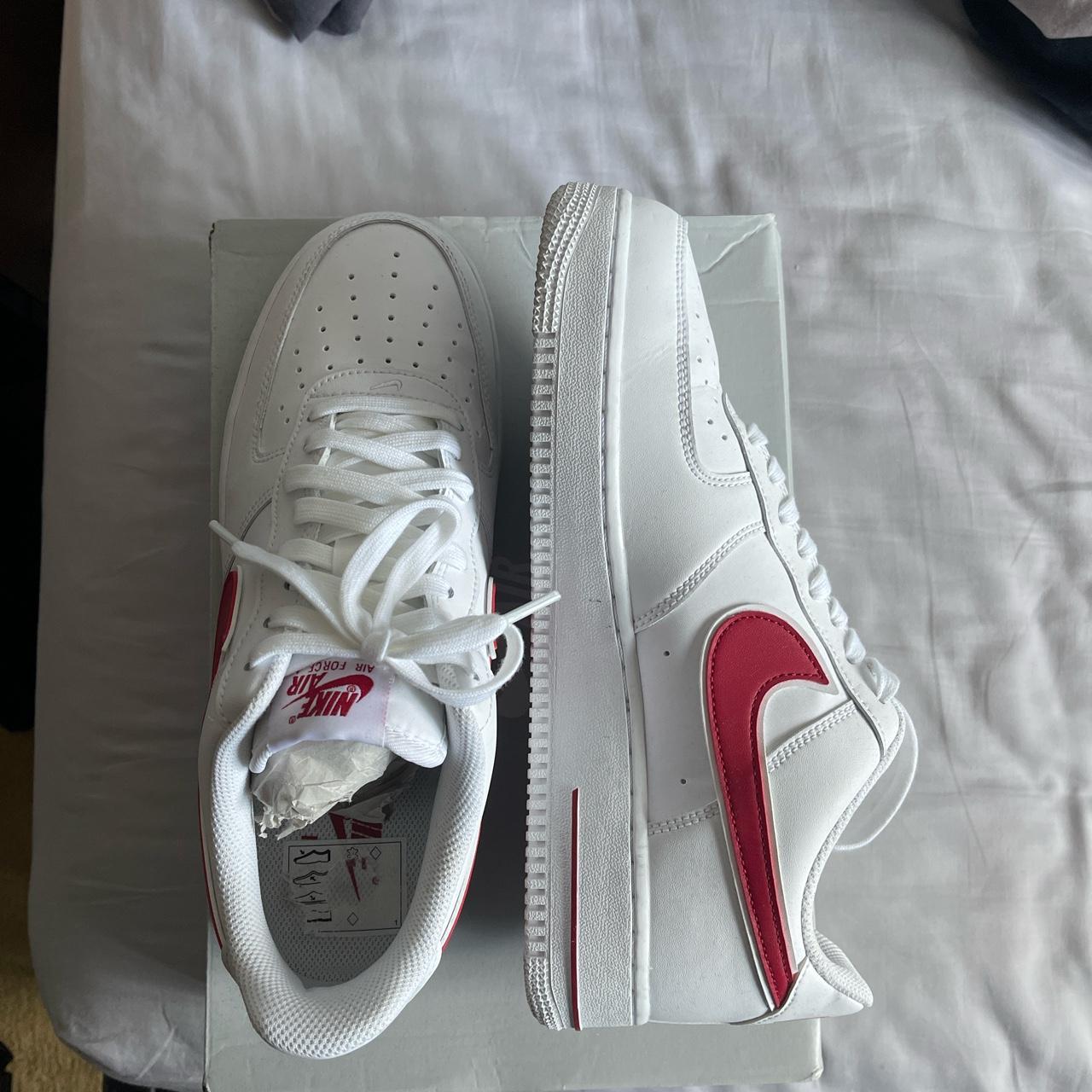 white nike shoes red tick