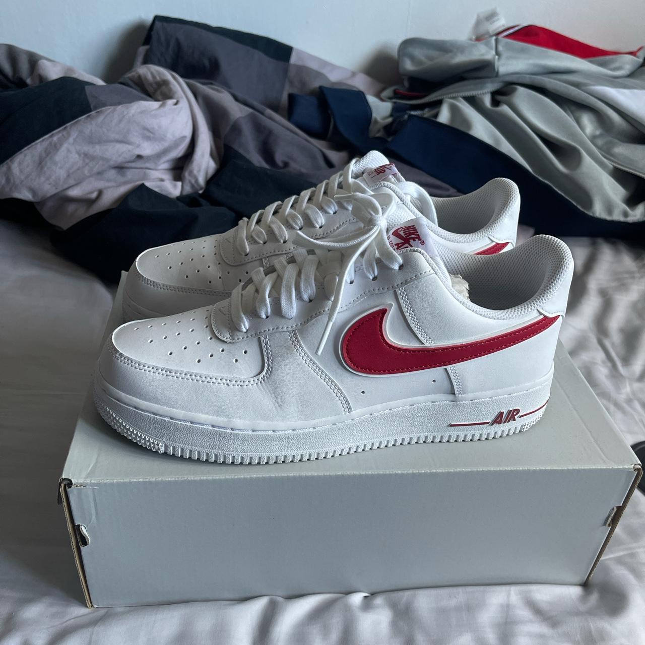 white nike shoes red tick