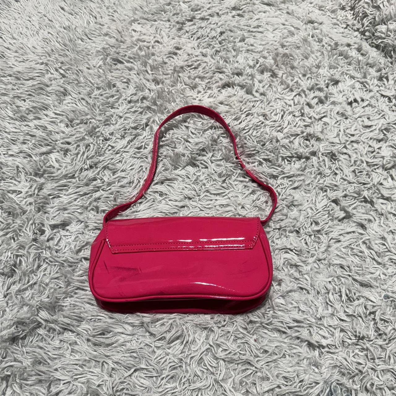 Hot pink patent leather shoulder bag with a short