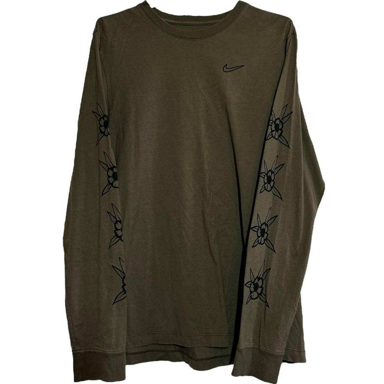 olive green and black nike shirt