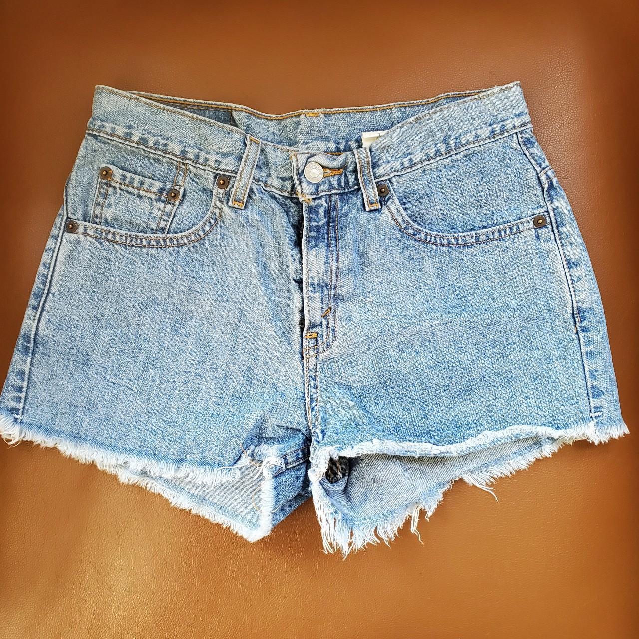 vintage Levi's jean shorts raw hem; true denim... - Depop