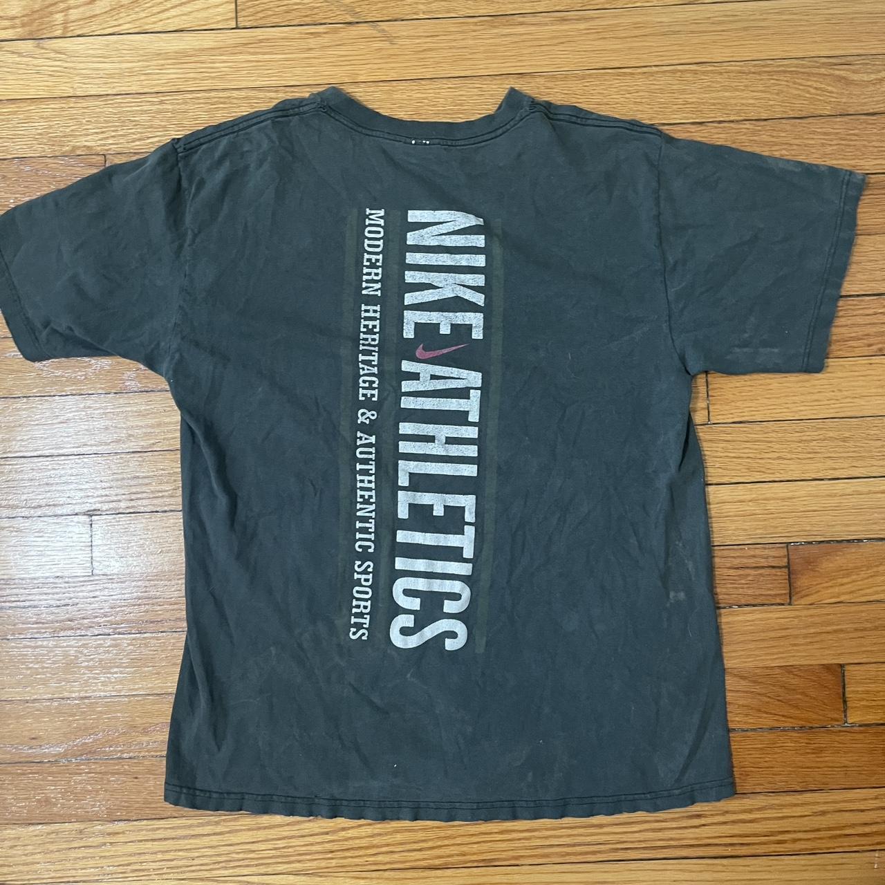 green and gray nike shirt