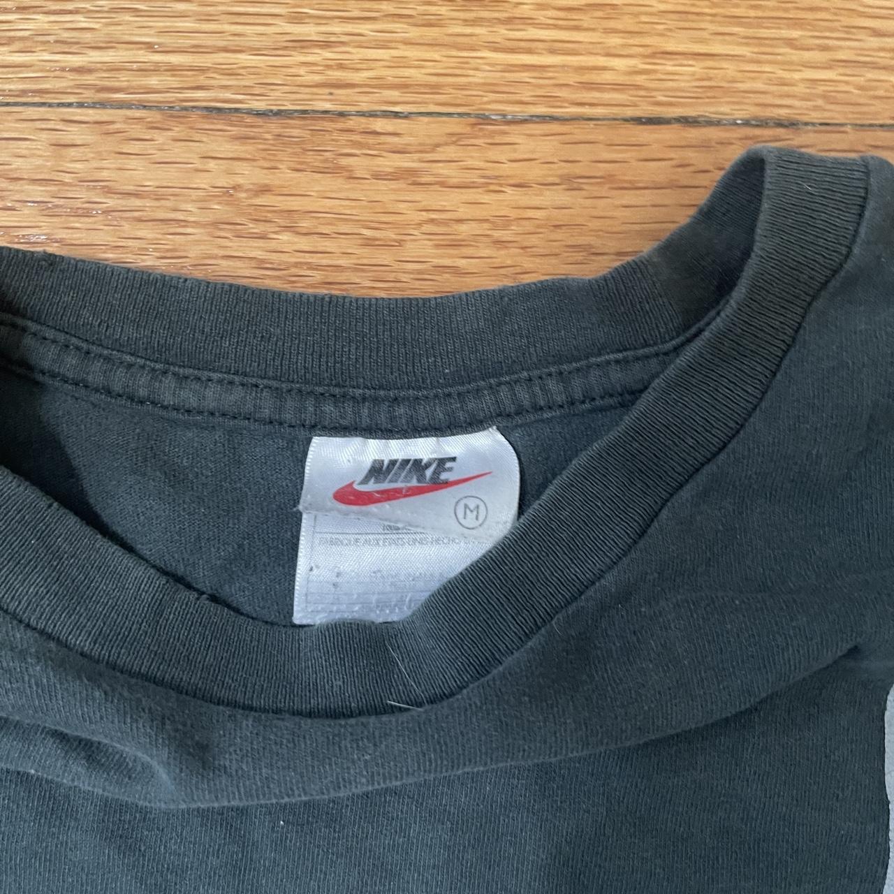 green and gray nike shirt