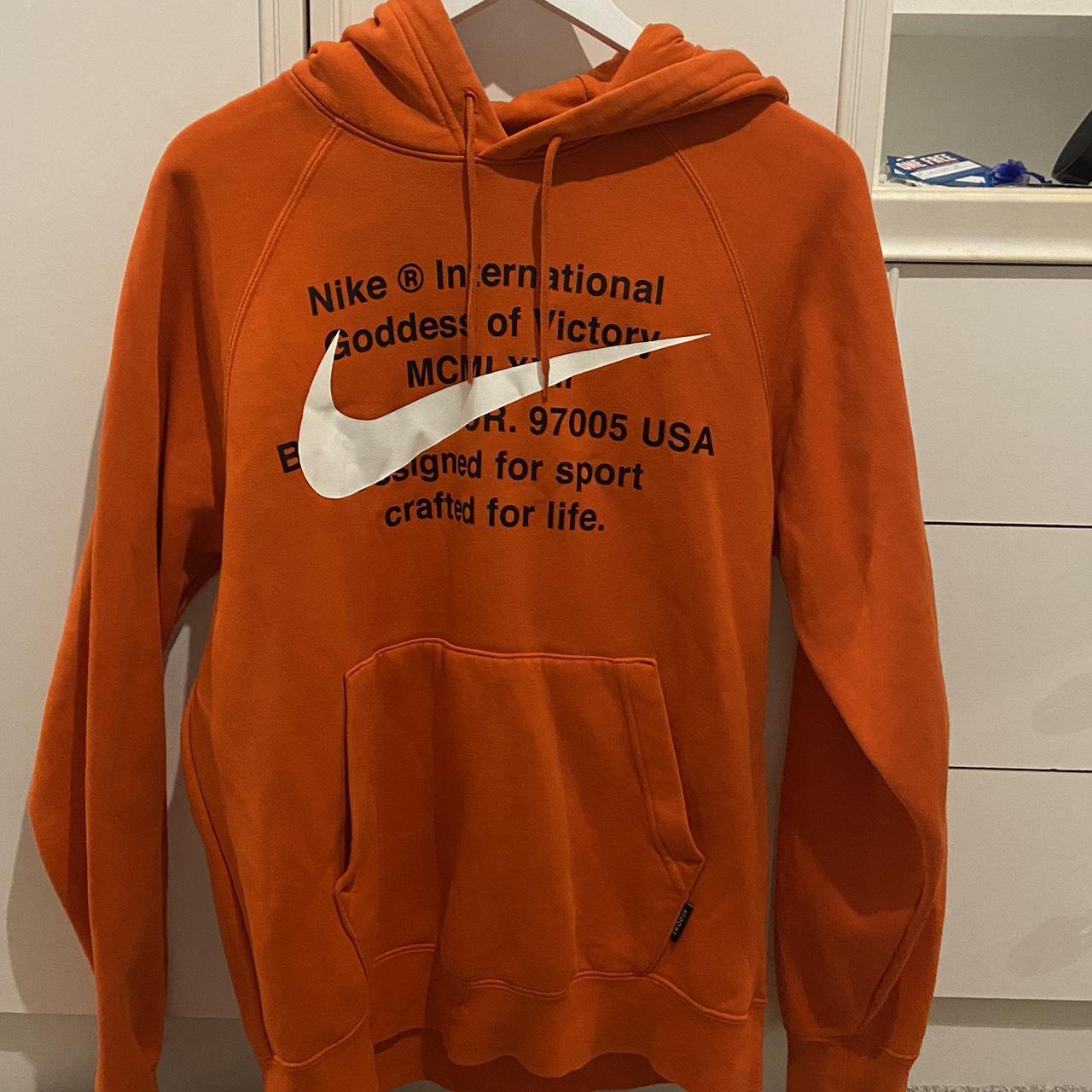 Nike international hotsell hoodie orange