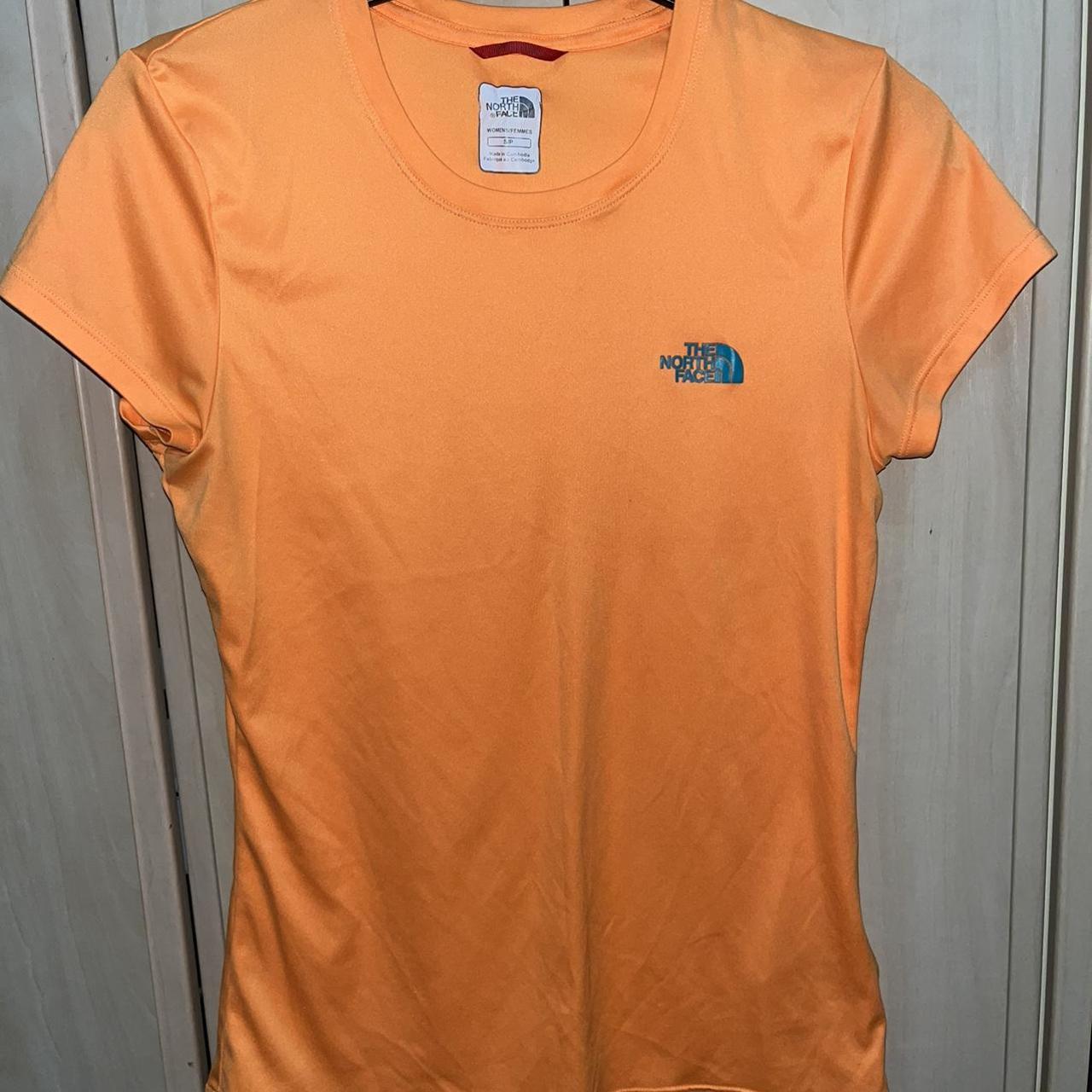 Womens north face tshirt size small. Bright orange... Depop