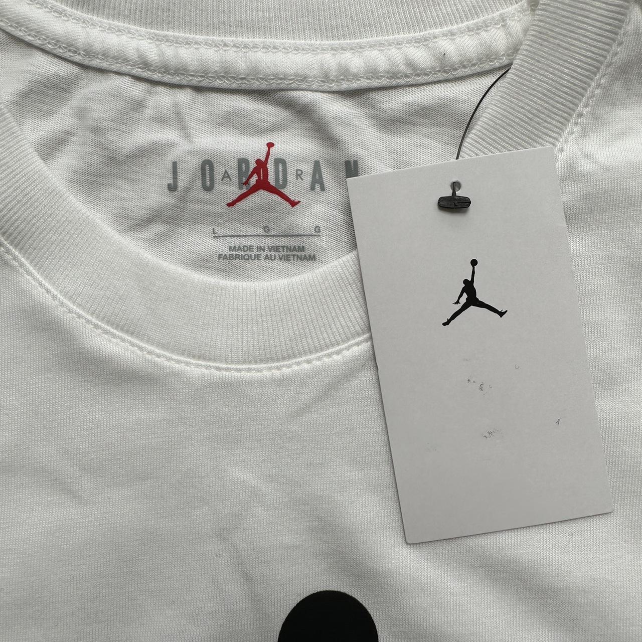 Large white Jordan T-shirt. Unworn still with tag... - Depop