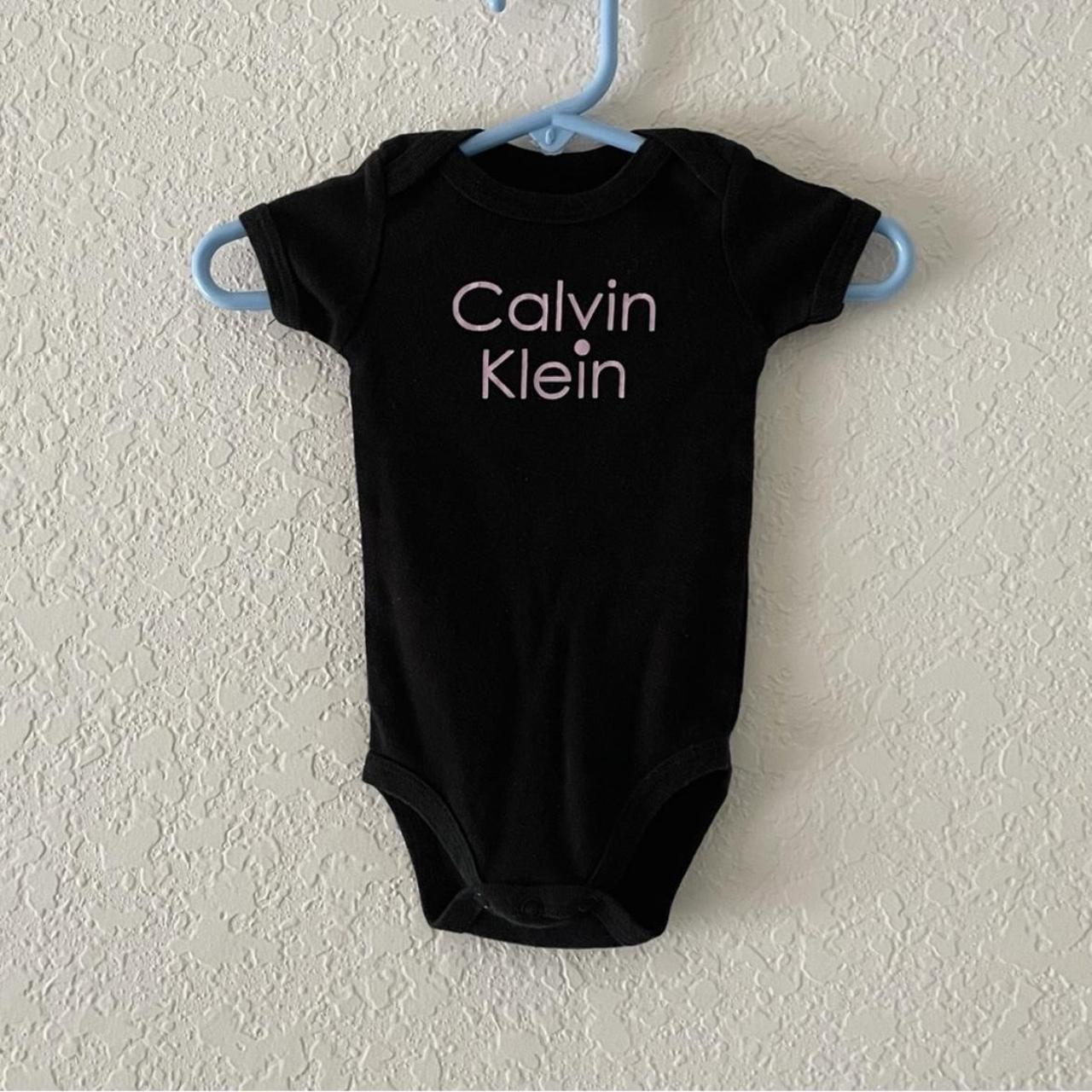 Calvin Klein onesie in good condition! The logo at...