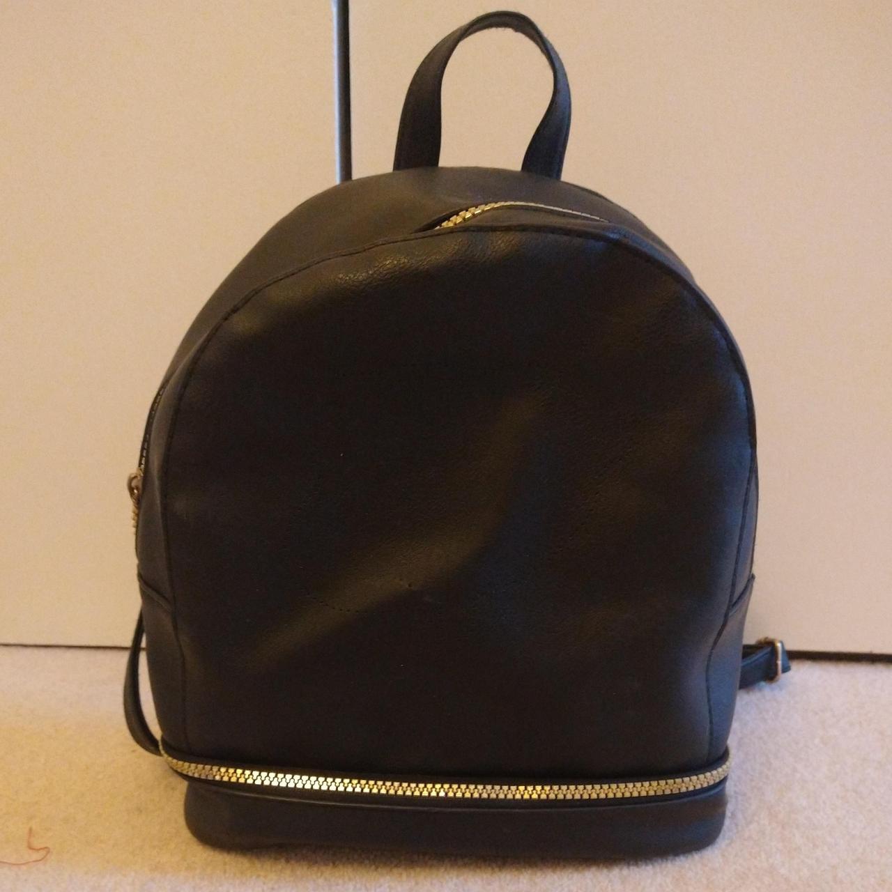 Black mini Primark backpack has a missing zip and