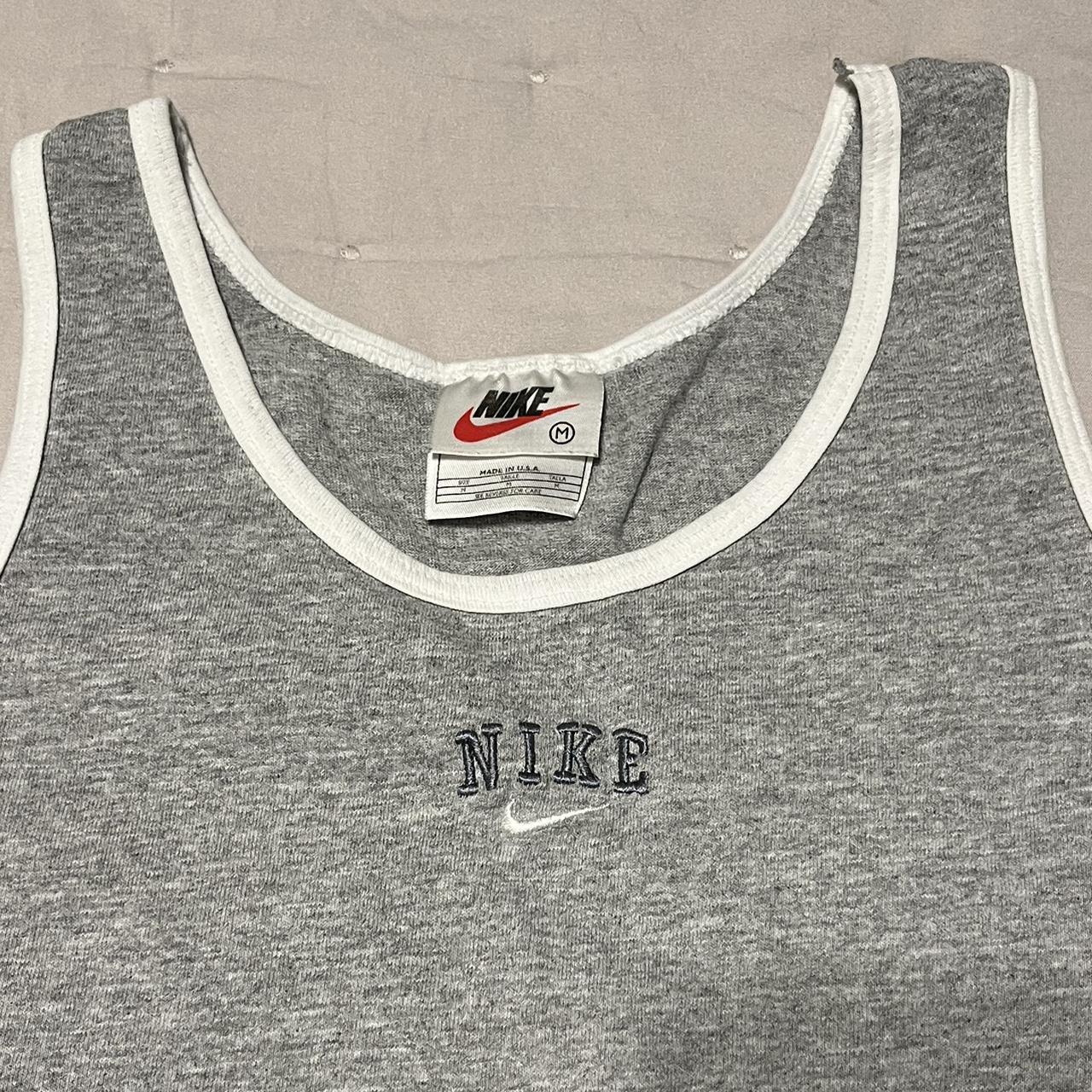 green and gray nike shirt