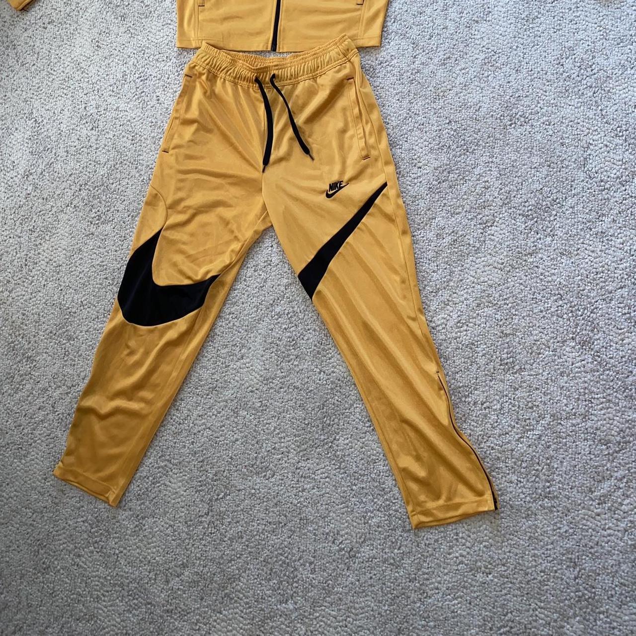 Nike yellow jumpsuit best sale