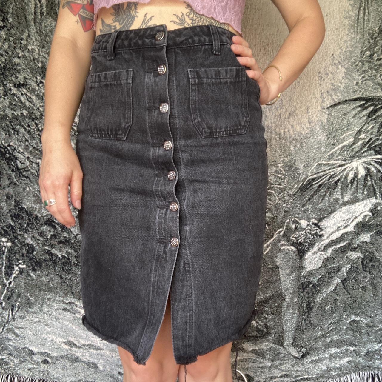 Perfect mid length black denim skirt. Lots of leg