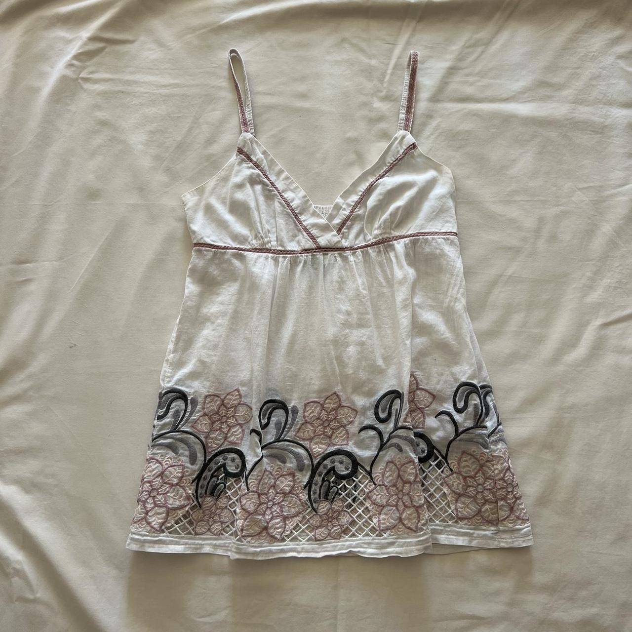 babydoll tank top with a floral embroidered bottom... - Depop