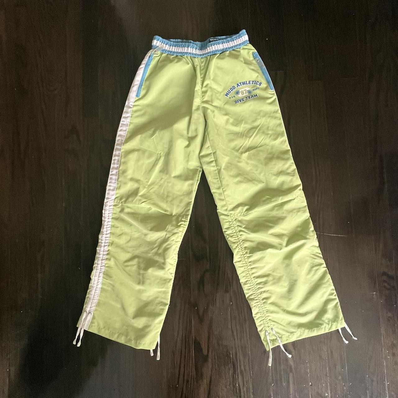 NWT Capri leggings by Zelos. Green with yellow, blue - Depop
