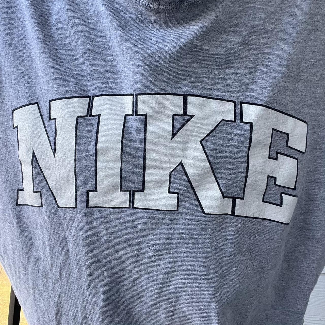 green and gray nike shirt