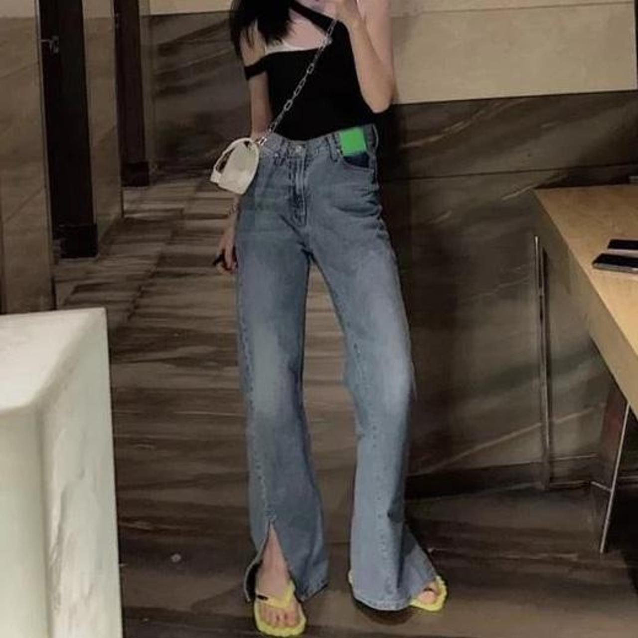 Ann Andelman asymmetrical twisted flared jeans...