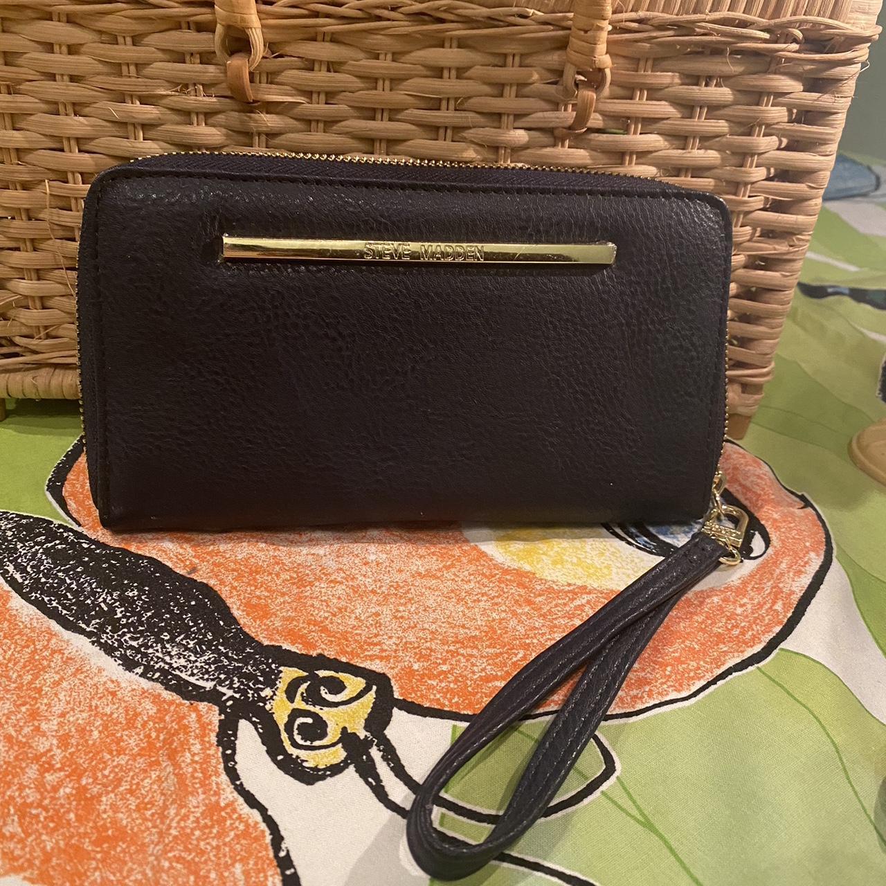 Steve shops Madden wristlet