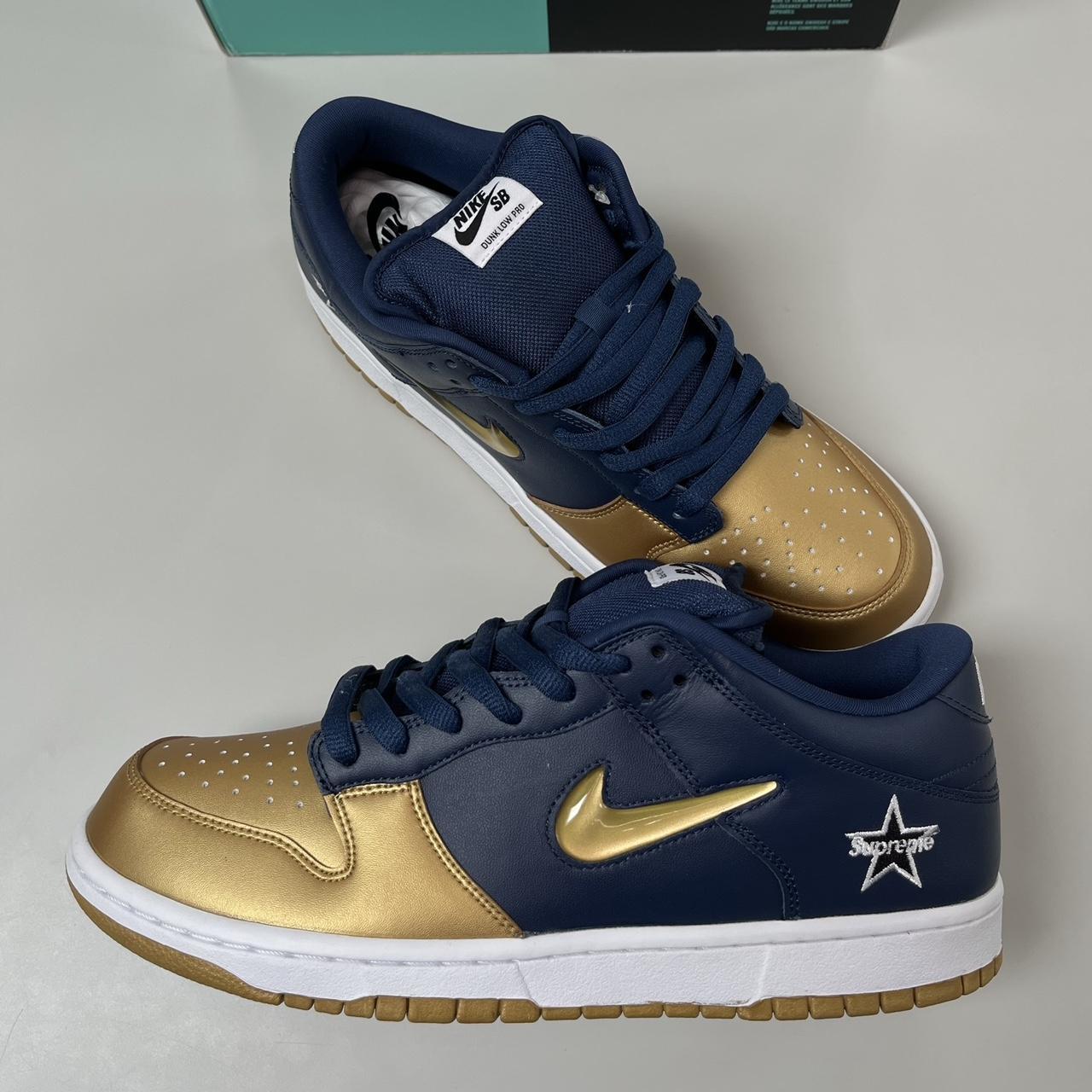 dunk low gold swoosh
