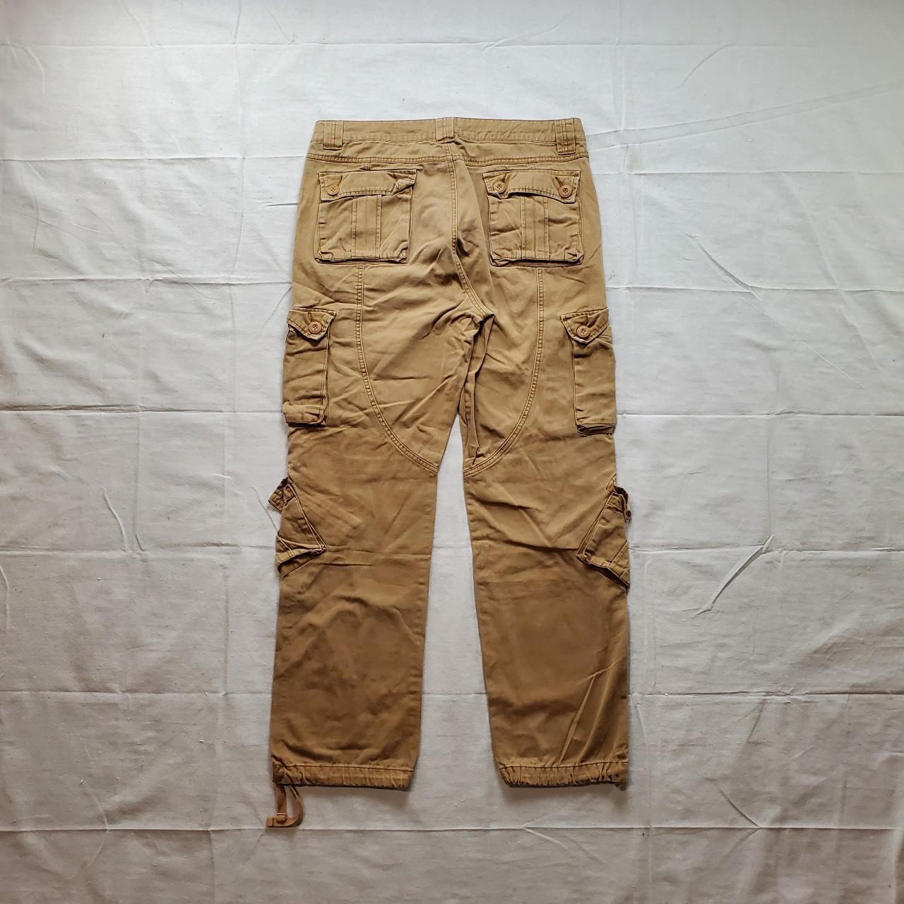 Tan adjustable cargo pants Tons of pocket space and... - Depop