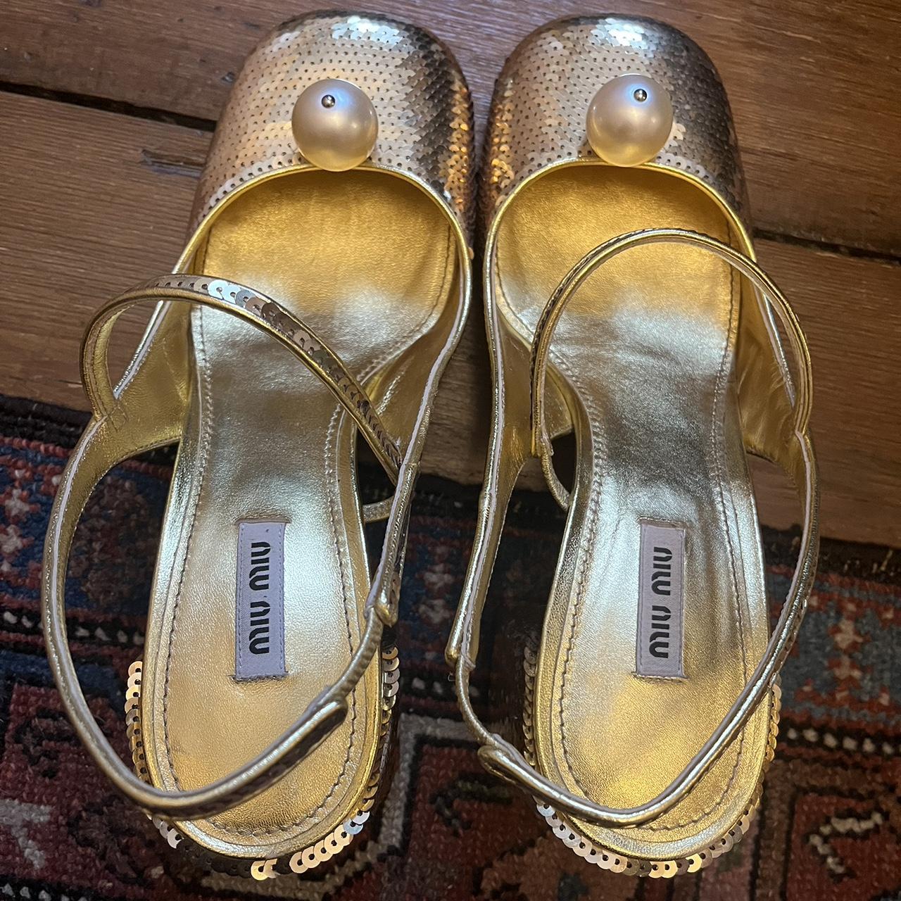 Gold sequin Miu Miu shoes with big Pearl detail.