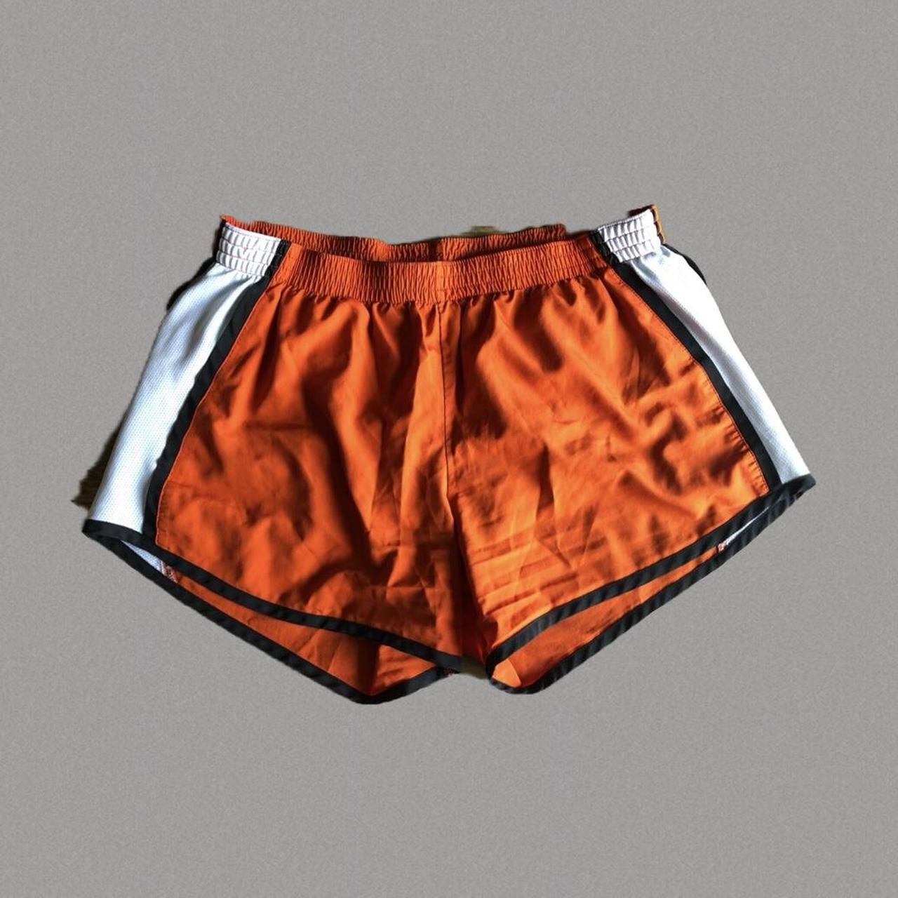 Orange black and white best sale nike shorts