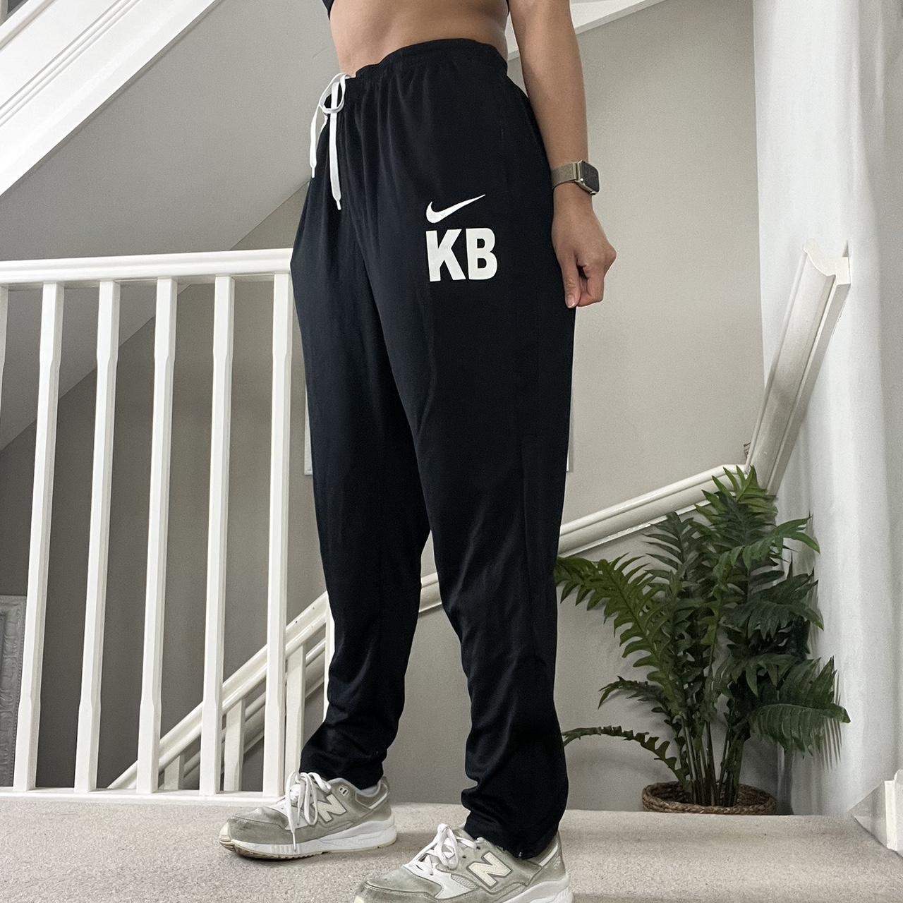 Nike Black 00s oversized fit tapered leg track pants | Depop