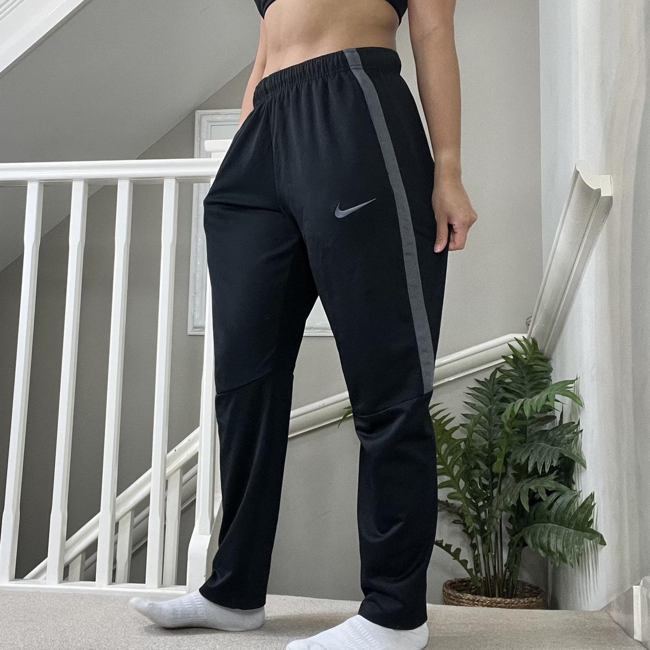 Nike tapered tracksuit bottoms best sale