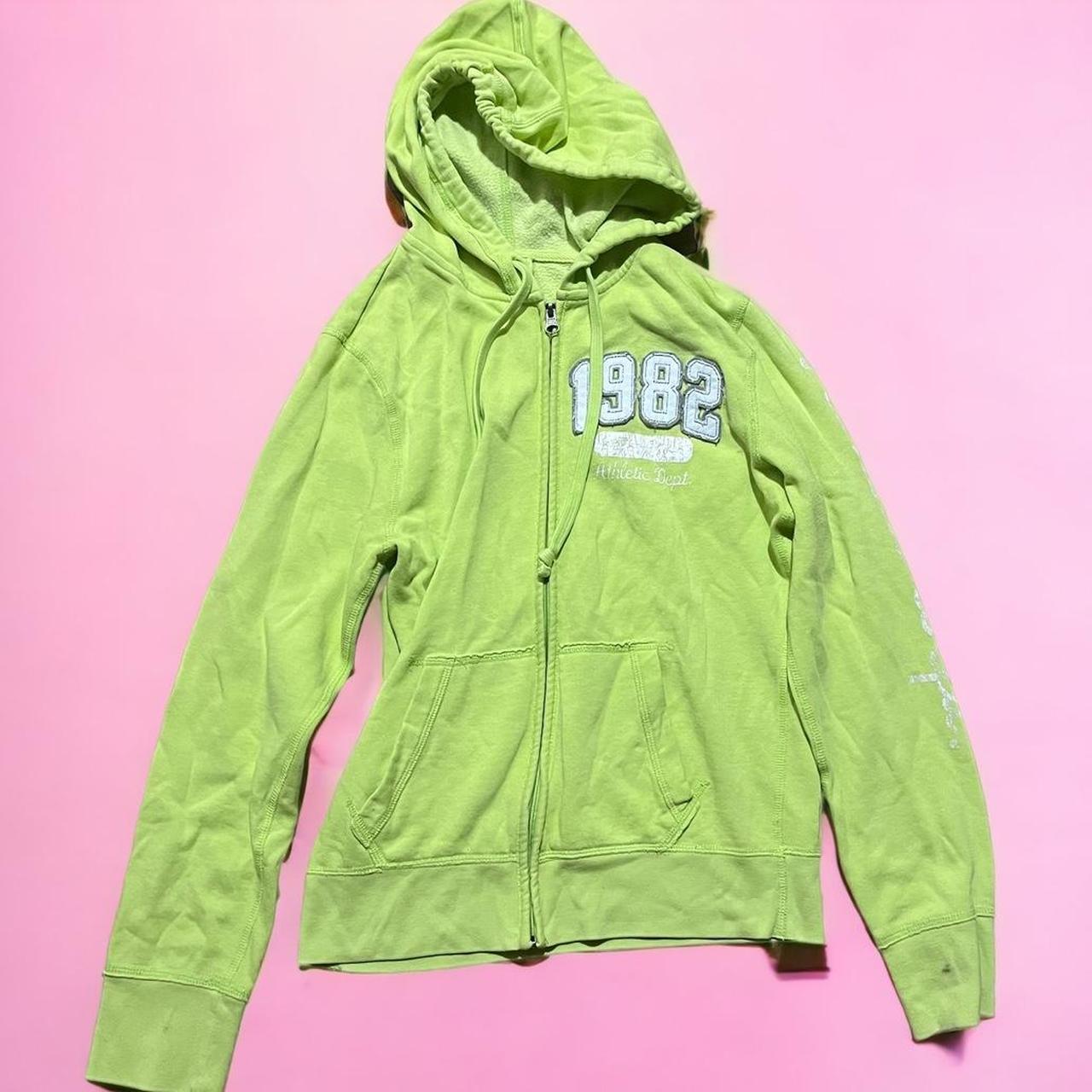 lime green graphic hoodie. wording has some fading