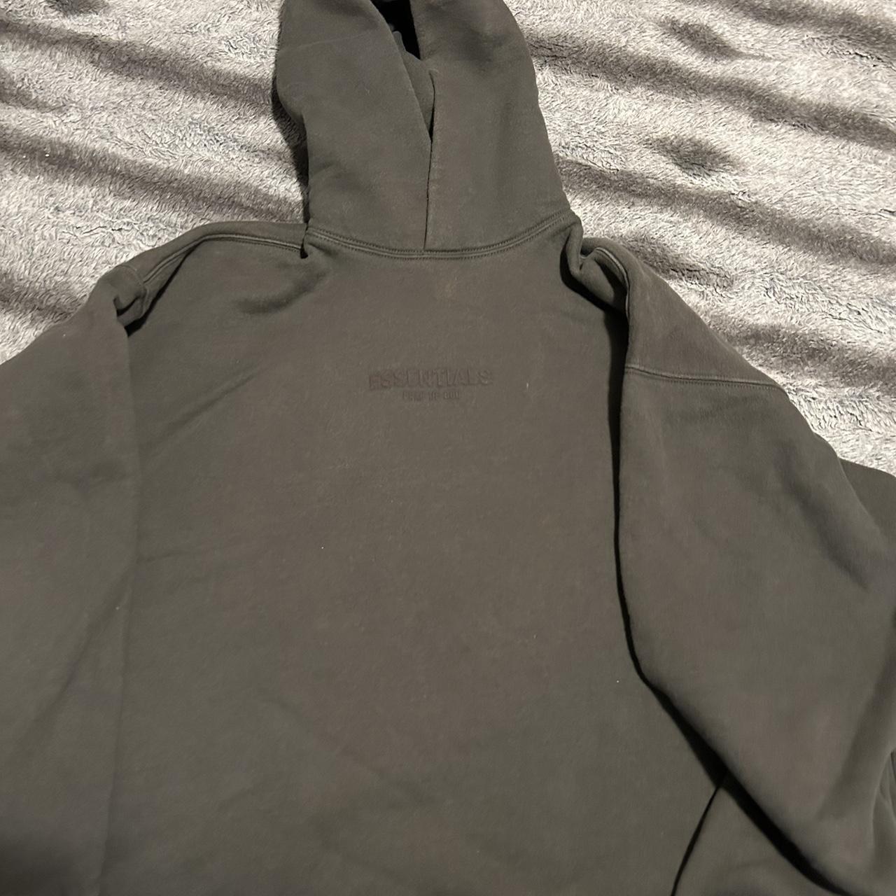 Essentials hoodie is oversized so prolly will fit a L - Depop