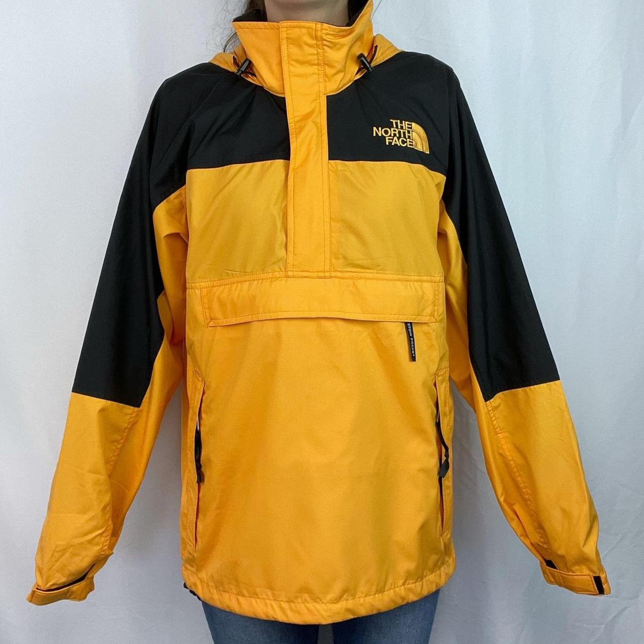 The North Face black and yellow windbreaker 3/4... - Depop