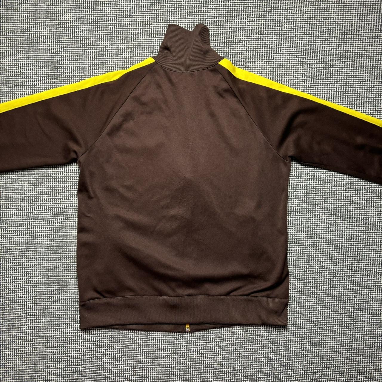 Brown and yellow puma zip up track jacket. Size | Depop