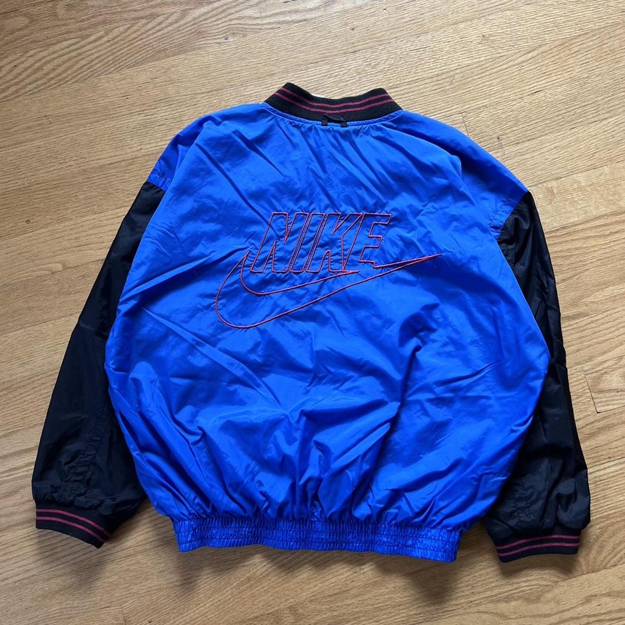 Nike windbreaker big logo best sale