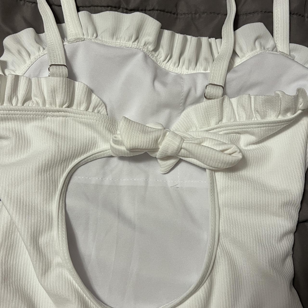 White ruffled one piece swimsuit with open tie back - Depop