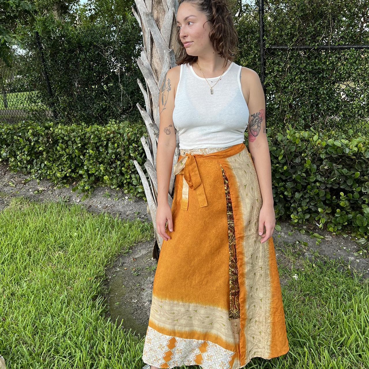 Orange printed wrap around skirt One size Model... - Depop