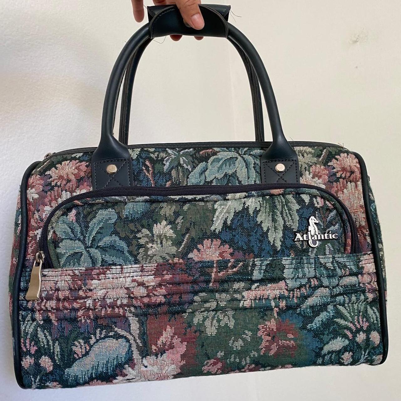 Floral tapestry duffle bag with leather handles