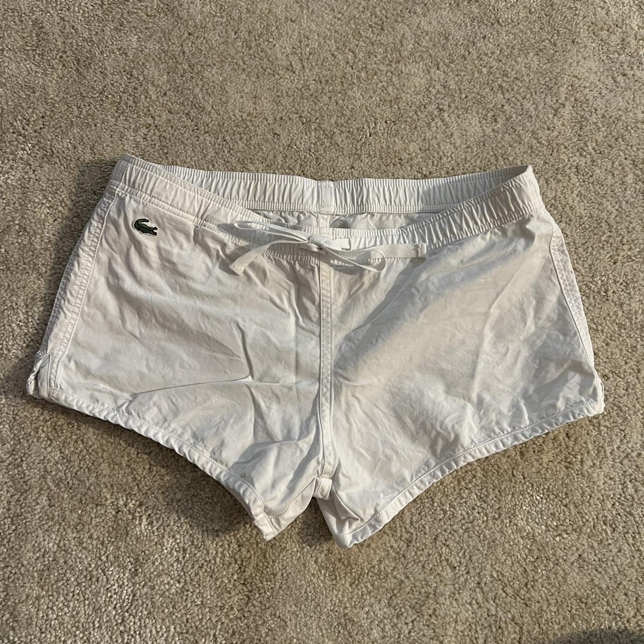 white lacoste shorts labeled size 4, recommend for... - Depop