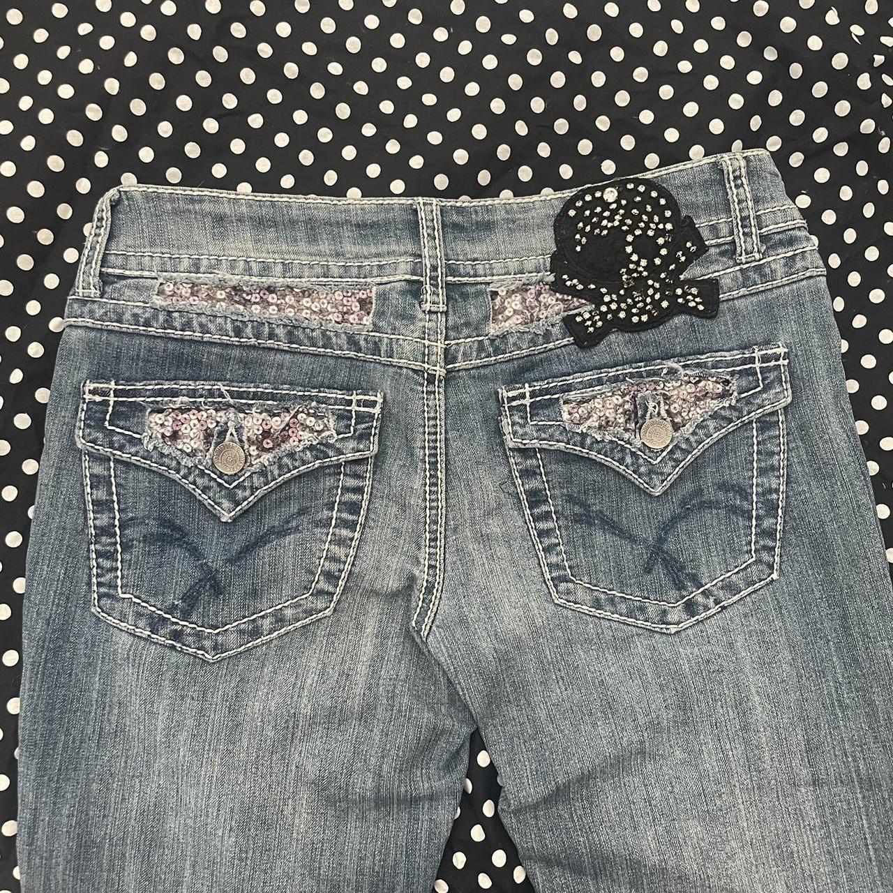 Early 2000s low rise vanilla star jeans with a skull... - Depop