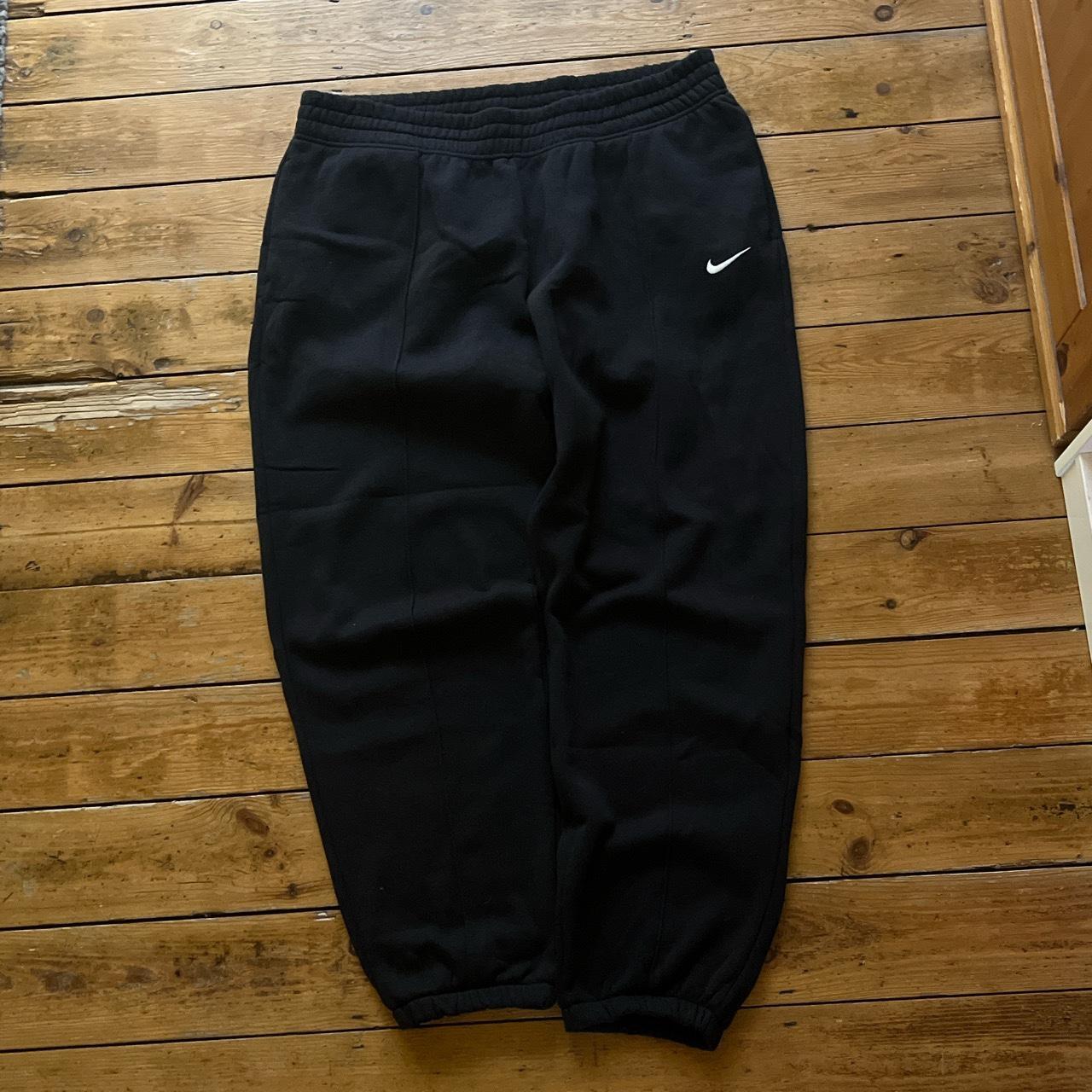 Super sick baggy Nike fleeced joggers in black with... - Depop