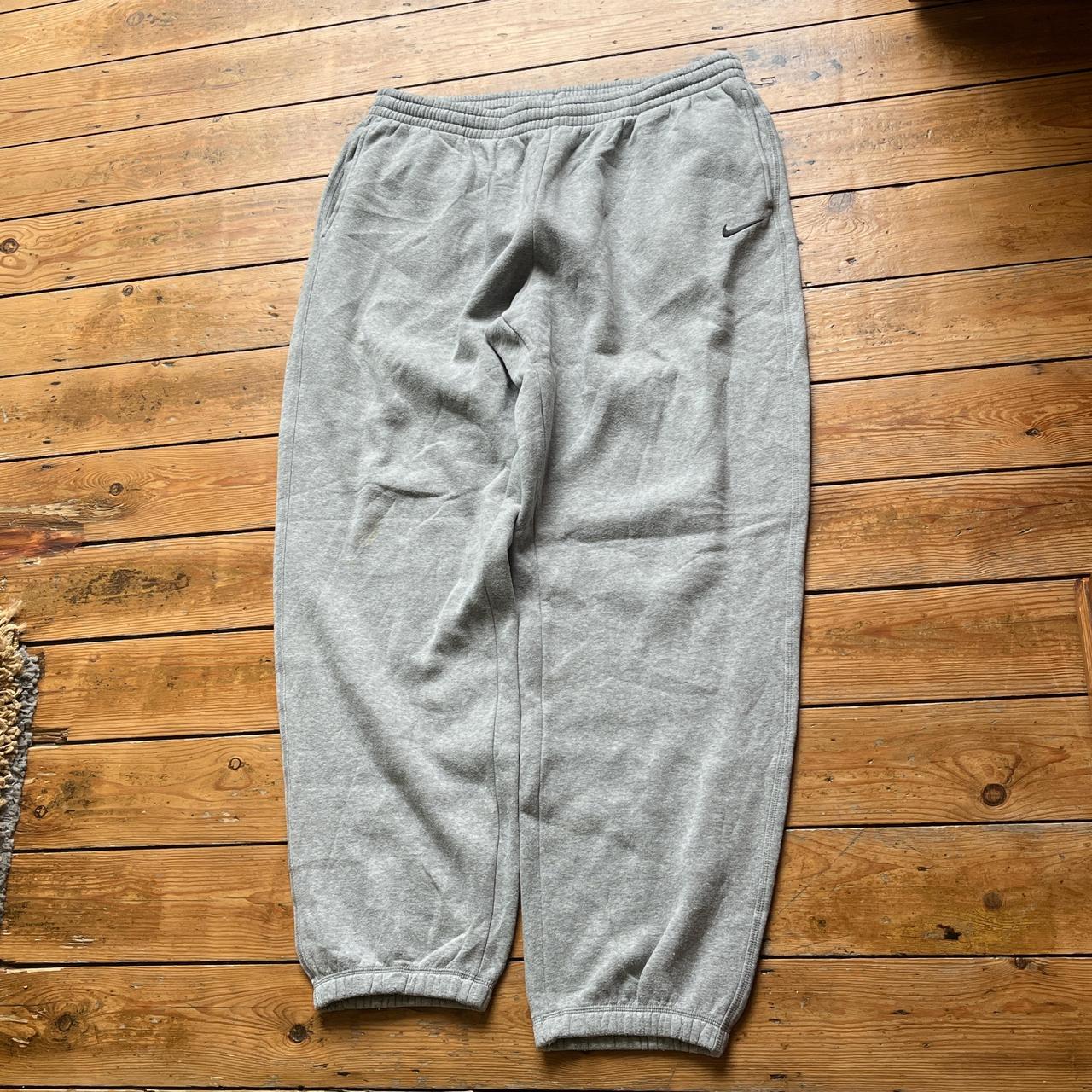 Super sick vintage baggy Nike joggers in grey with a... - Depop