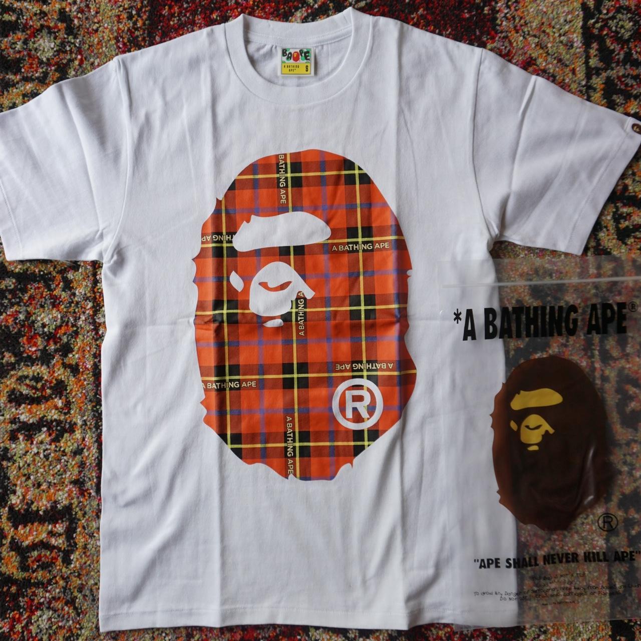 white and orange bape shirt