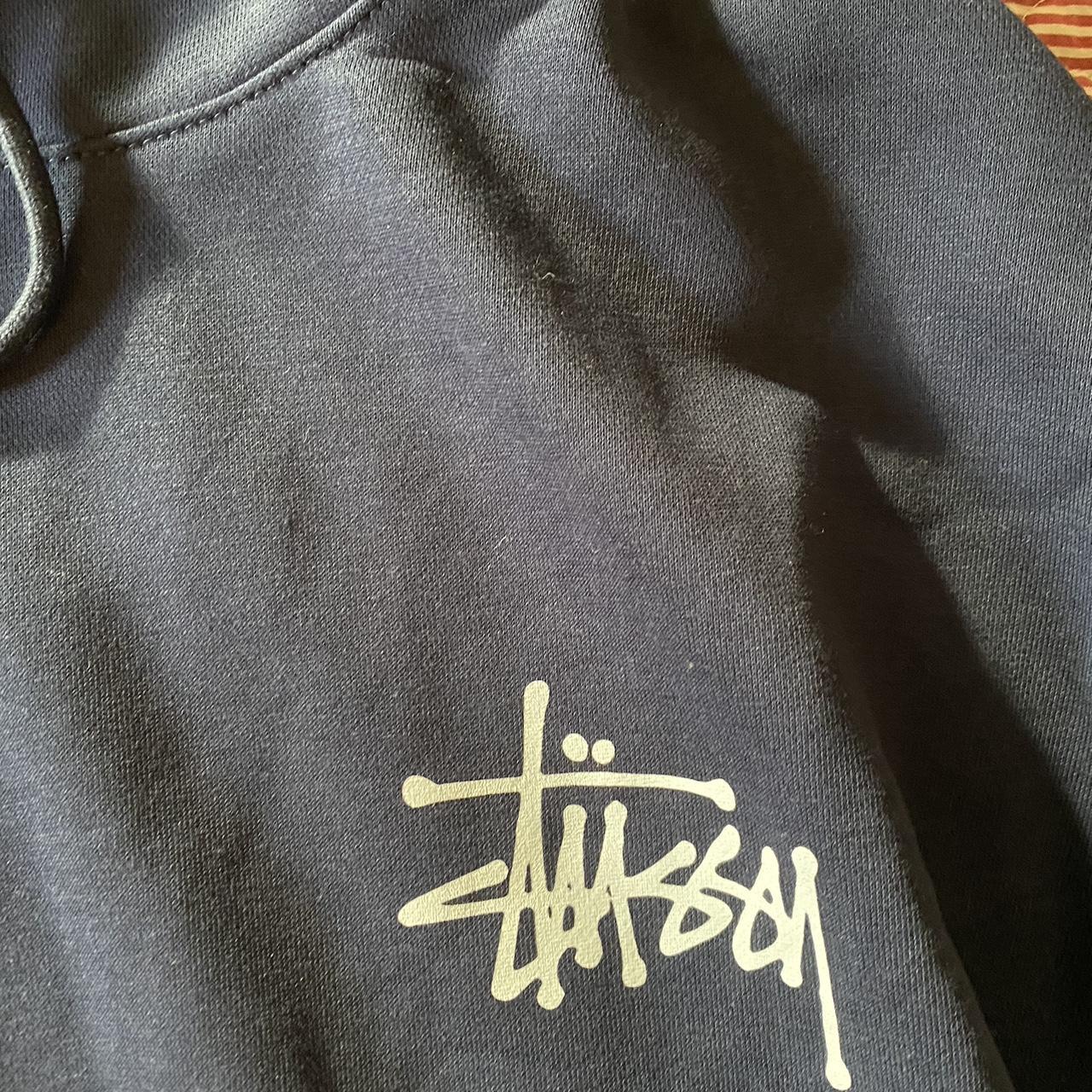 Navy Stussy hoodie logo printed on the back and... - Depop