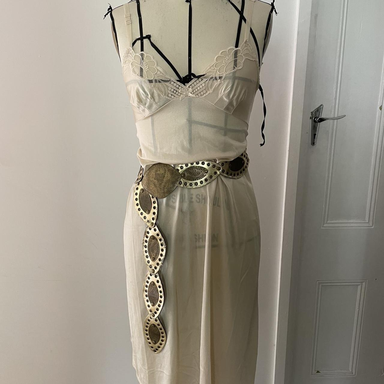 Vintage beige slip dress with lace bust detailing.... Depop